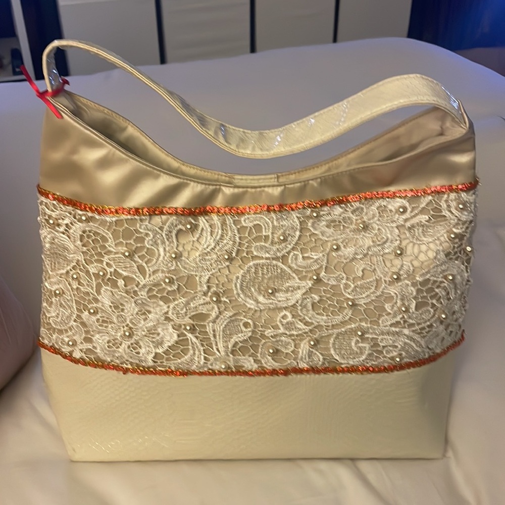 Beautiful custom made beige handbag with embroidery.